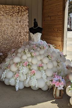 a dress made out of balloons and flowers