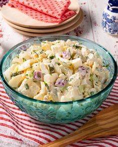 a bowl filled with potato salad on top of a table