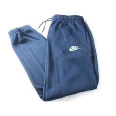 Nike Sportswear Men's Tapered Leg Fleece Lined Jogger Pants Midnight Navy Blue. Nike Sportswear Men's Tapered Leg Fleece Lined Jogger/Sweatpants. Brand New With All Original Tags. "Midnight Navy Blue" In Color With 2 Front Pockets . Modern In Design These Pants Are Standard Fitting With Tapered Leg Design And Regular Length. Nike Logo On The Front. Super Versatile, Lightweight And Comfortable, These Pants Are Soft Cotton And Polyester In Material. As Always We Guarantee Authenticity. Nike Style Nike Blue Pants For Jogging, Blue Nike Pants For Jogging, Sporty Navy Bottoms For Leisure, Nike Blue Jogging Pants, Navy Sportswear Sweatpants With Pockets, Navy Sweatpants With Pockets For Sportswear, Blue Fleece Bottoms For Winter, Winter Blue Fleece Bottoms, Navy Nike Activewear For The Gym