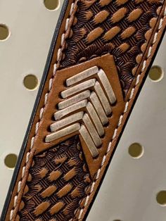 a close up of a belt with holes in it