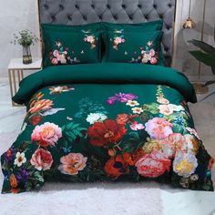 a bed with green sheets and flowers on it