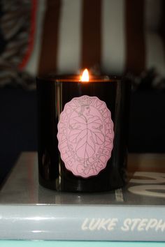 a candle that is sitting on top of a book