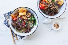 two bowls filled with different types of food