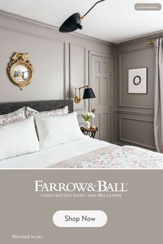 a bedroom with gray walls and white bedding is featured on the farrow & ball website