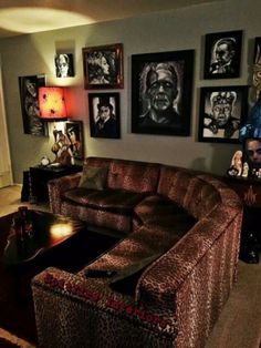 a living room filled with furniture and pictures on the wall