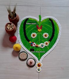 a green heart shaped rug sitting on top of a wooden table