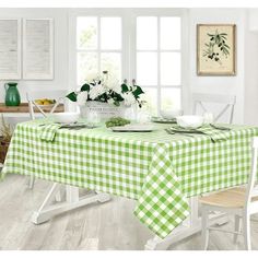 a green and white checkered tablecloth on a dining room table