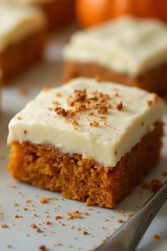 a piece of carrot cake with cream cheese frosting