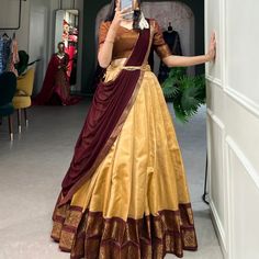 Crafted with love, adorned with heritage : The South-style Kanchipuram silk lehenga is more than just attire; it's a piece of art that encapsulates the essence of South Indian culture 🪸 ll12l Lehenga(Stitched) Lehenga Fabric : Kanchipuram Lehenga Work : Zari Weaving Work Lehenga Waist : SUPPORTED UP TO 42 Lehenga Closer : Drawstring With Zip Stitching : Stitch With Canvas Length : 41 Flair : 3.70 Meter Inner : Micro Cotton Blouse(Unstitched) Blouse fabric : Kanchipuram Blouse Work : Zari ... Cotton Saree Lehenga Designs, Kerala Wedding Outfits Sisters, Silk Saree Dress Recycle, Silk Half Saree Designs, Dhavani Half Saree Color Combos, South Indian Traditional Dress, Copper Lehenga, South Indian Attire, South Indian Half Saree