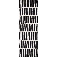 a black and white striped rug with vertical lines on the bottom, diagonally drawn across it