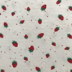 the fabric has strawberries on it and is white with red polka doting,