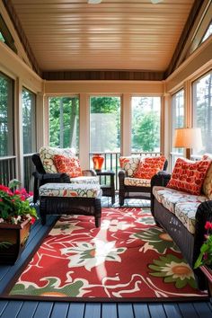 a sun room with two couches and chairs