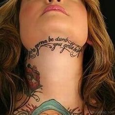 a woman with tattoos on her neck and chest