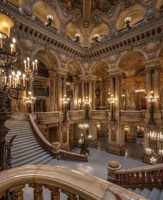 an ornate building with many chandeliers and lights