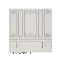 the wall paneling is white and has ornate designs on it