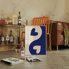 an image of a book and wine glass on the floor