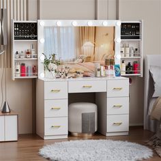 a white vanity with lights on it and a mirror over the top that is open