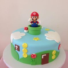 a birthday cake with a mario on top