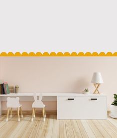 an empty room with two white chairs and a desk in front of a pink wall