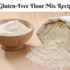 a wooden bowl filled with flour next to a bag of flour on top of a table