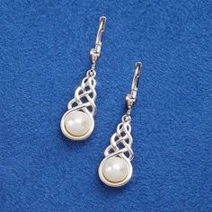 These are the sterling silver earrings that feature a Celtic knot-pattern and freshwater pearls. One of Ireland’s most iconic symbols, Celtic knots have decorated Irish art since the early Middle Ages and symbolize eternity. The white freshwater pearls have natural variations (no two will be exactly alike). The unique pearl earrings are hallmarked in Dublin Castle—guaranteeing Irish authenticity. Unique Pearl Earrings, Hozier Concert, Celtic Braid, Irish Earrings, Knot Pattern, Dublin Castle, Hammacher Schlemmer, Celtic Earrings, Early Middle Ages