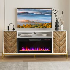 an entertainment center with a fireplace in the middle and a painting on the wall above it