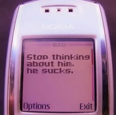 an old cell phone with the text stop thinking about him, he sucks options exit