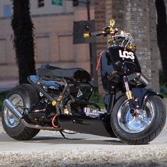 a black motorcycle parked on the side of a road