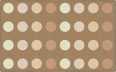 a brown and white polka dot rug