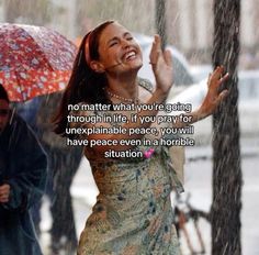 a woman holding an umbrella in the rain