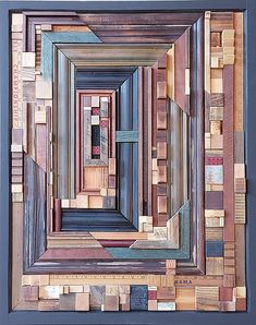 an art piece made out of wood with different colors and shapes on it's sides