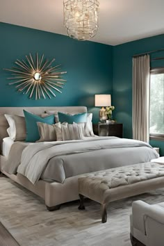 a bedroom with teal walls and white furniture