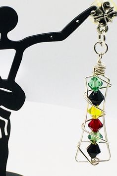 SALE:MUST BUY 2 FEATURED ITEMS FOR EACH 50% OFF CURRENT PRICE: :VIDEO AVAILABLE: These pierced earrings are my version of the 'caged crystal' that is timeless and eloquent. This piece, however, is a tower of sterling silver wrapped wire into a 2 inch cage of Swarovski faceted green, black, yellow and red 6mm bicone crystals. Both the sterling silver frame and the crystals are highly reflective, which is attenuated with transferred motion without much head movement. The decorative findings are un Faceted Crystal, Pierced Earrings, Silver Frame, Earings Piercings, Jewelry Earrings Dangle, Dangle Drop Earrings, Dangle Earrings, Motion, Tower