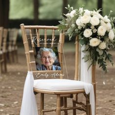 an old lady sitting in a chair next to a bouquet of flowers on the ground