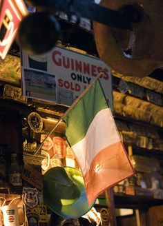 an irish flag hanging from the ceiling in a bar