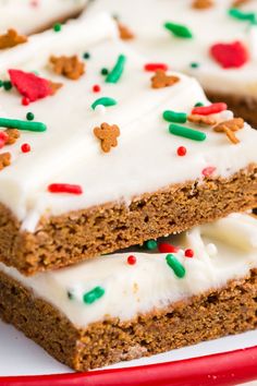 two pieces of cake on a plate with white frosting and sprinkles