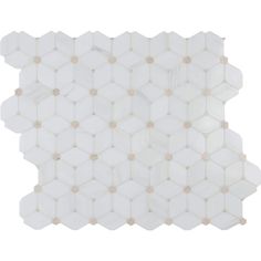 a white and gold mosaic tile pattern on the wall, with small circles around it