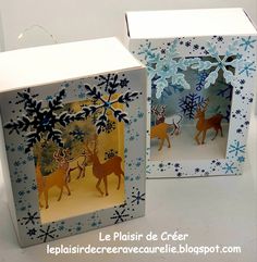 two boxes are decorated with snowflakes and deer