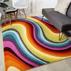 a multicolored area rug in a living room