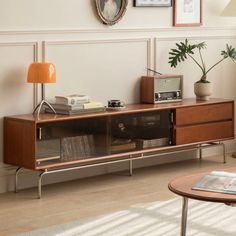 a living room scene with focus on the entertainment center and coffee table in the foreground