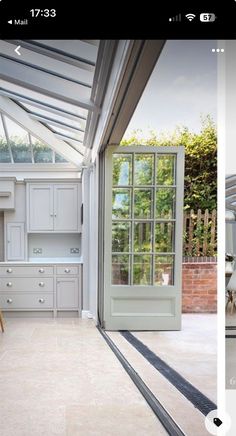 an image of a kitchen being viewed from the outside with two different angles to see