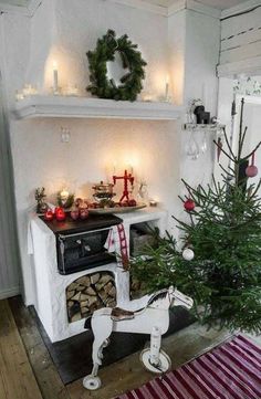 a small christmas tree sitting in the corner of a room