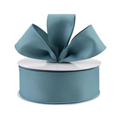 a blue satin ribbon with a bow on the top and bottom, sitting in front of a white background