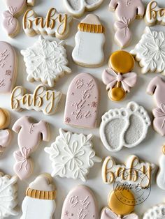 baby shower cookies are arranged on a table