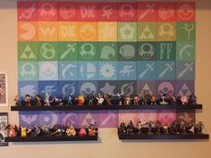 several shelves with various toy figures on them in front of a wall that has different colored squares