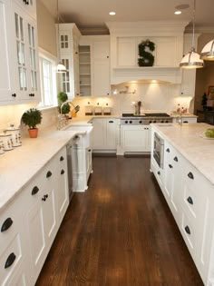 the kitchen is clean and ready for us to use it's white cabinetry