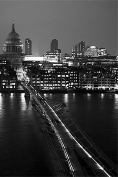 black and white photograph of city skyline at night