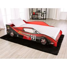 a bed with a race car design on it