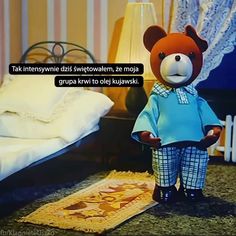 a teddy bear standing in front of a bed with a quote on it that reads,