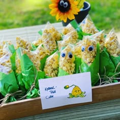 corn flakes are wrapped in green paper and have googly eyes on their faces